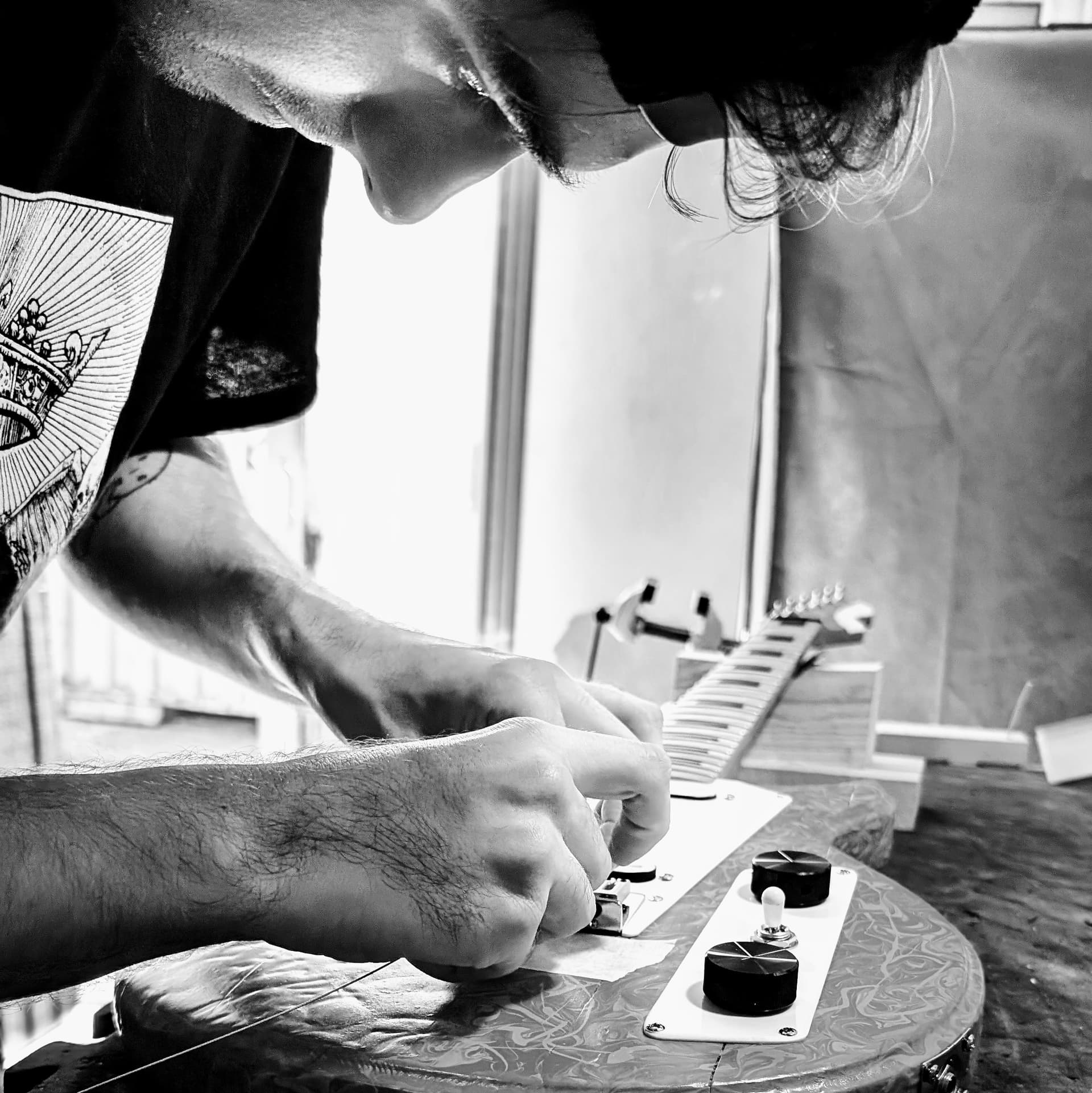 Hugh working on a guitar